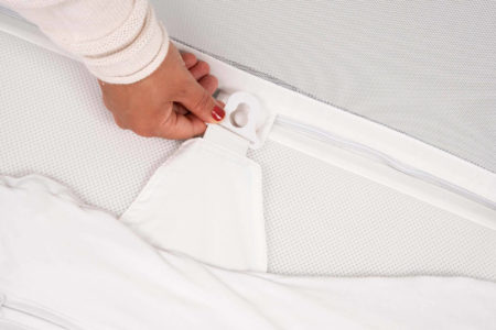 The Nini Swaddle clips into the NiniPod for safety and peace of mind